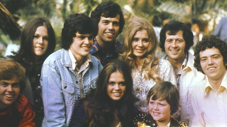 A group photo featuring members of the Osmond Family and others.