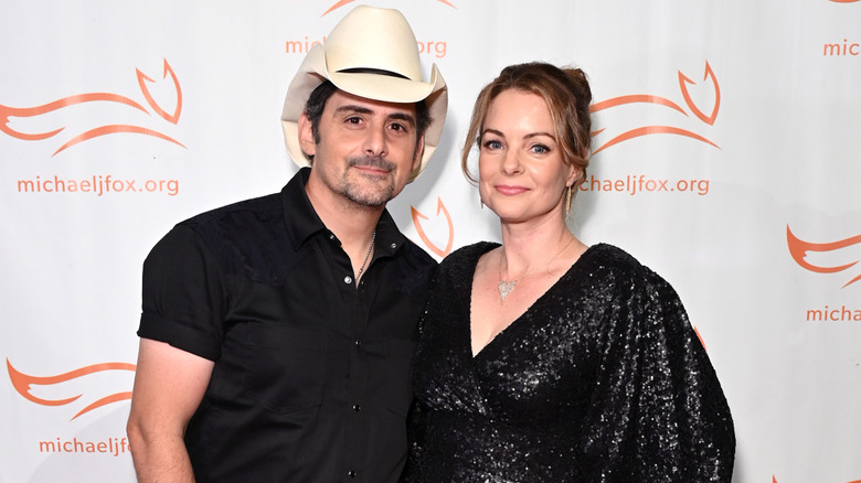 Brad Paisley posing with wife Kimberly Williams-Paisley on the red carpet