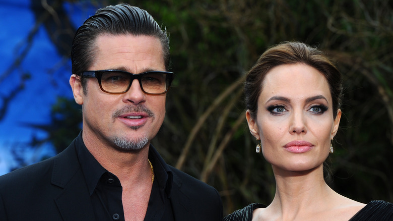 Brad Pitt and Angelina Jolie posing at premiere