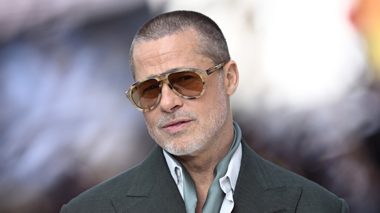 Brad Pitt wears sunglasses