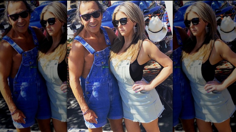 Brandi Passante poses in an overalls dress and sunglasses next to a friend outside