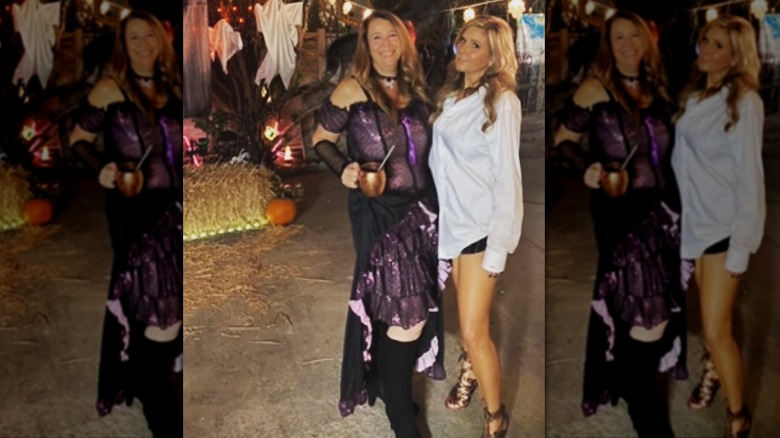 Brandi Passante wears a white button down shirt next to a friend on Halloween
