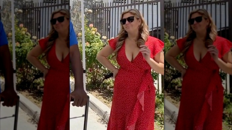 Brandi Passante films "Storage Wars" in a long red wrap dress