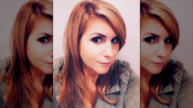 Brandi Passante taking a selfie with red hair.