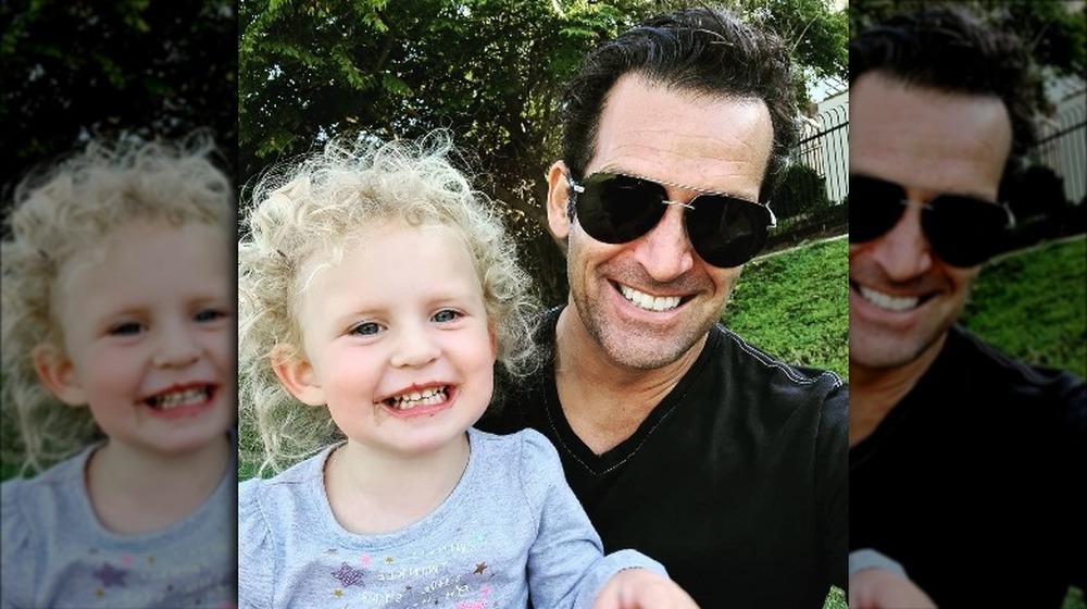 Braunwyn Windham-Burke's husband Sean takes a selfie with their daughter