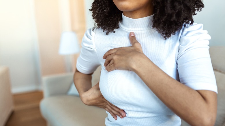 Woman doing a breast self exam