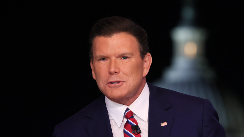 Bret Baier in navy suit and red striped tie