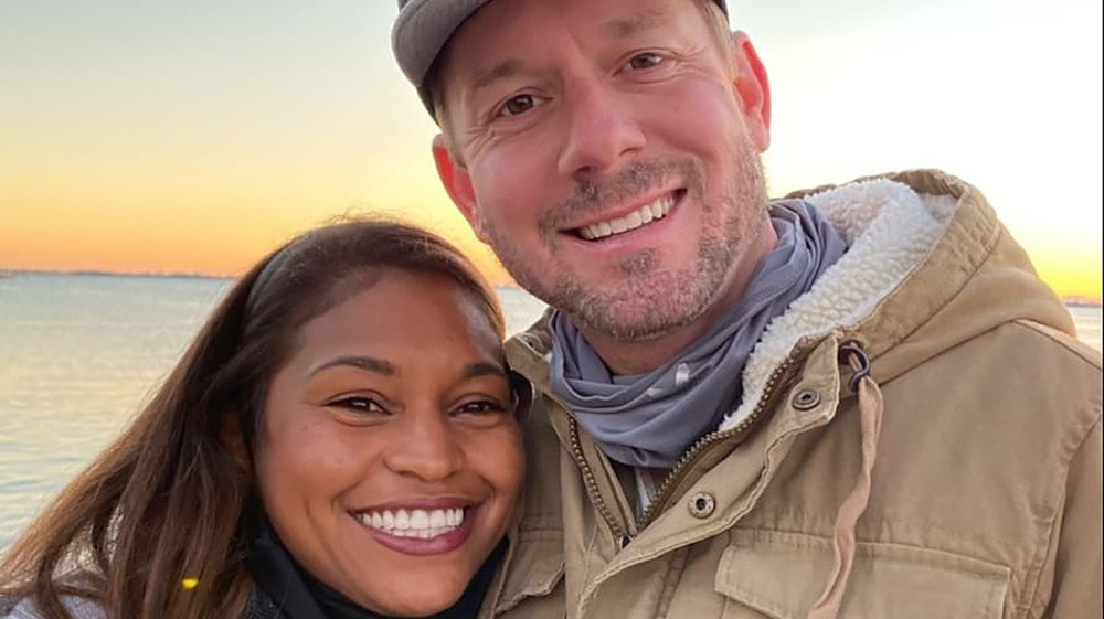 Mika and Brian Kleinschmidt smiling by the ocean