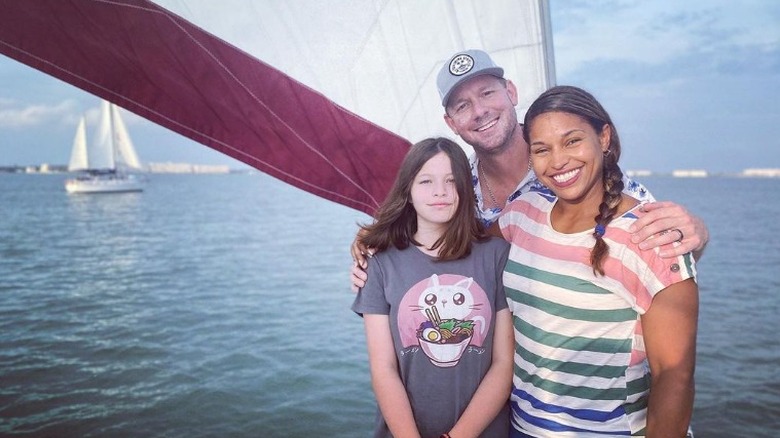 Brian and Mika Kleinschmidt and daughter on a boat