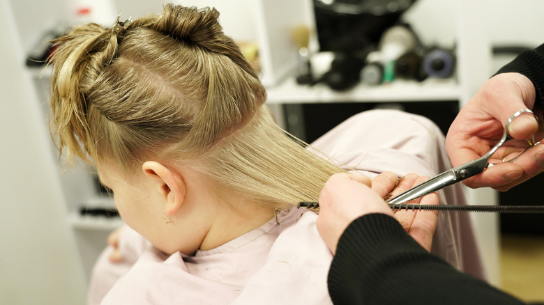 woman getting her hair cut