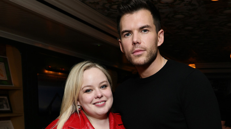 Nicola Coughlan and Luke Newton smiling