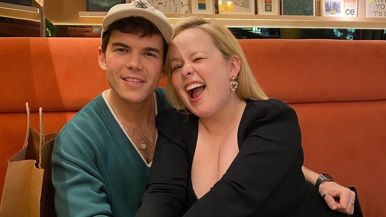 Luke Newtona and Nicola Coughlan smiling together