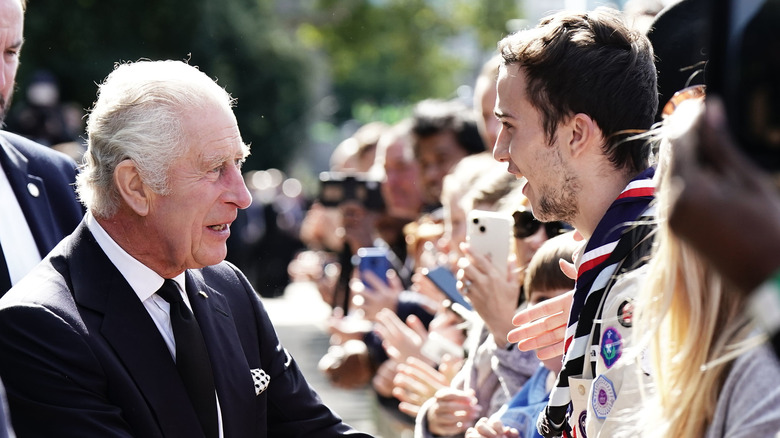 King Charles III thanks a citizen for waiting in line to see the queen