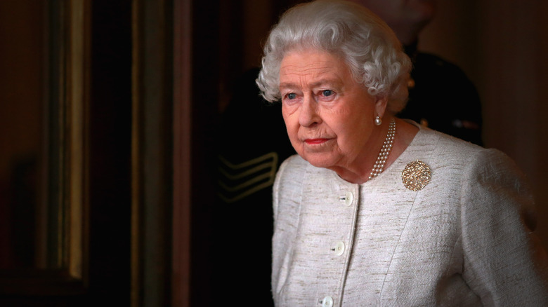 Queen Elizabeth II looking grim