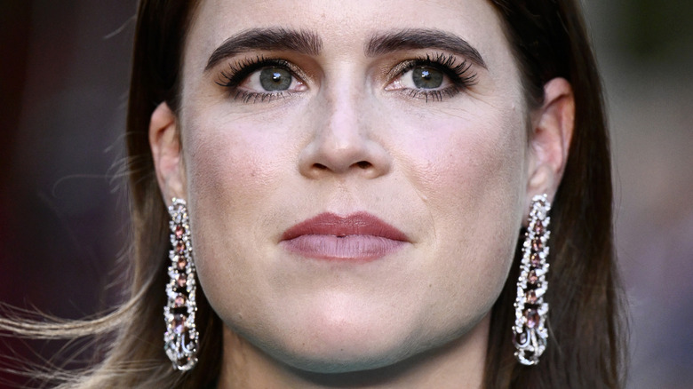 A close-up image of Princess Beatrice wearing dangly diamond earrings
