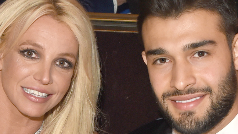 Britney Spears and Sam Asghari smiling 