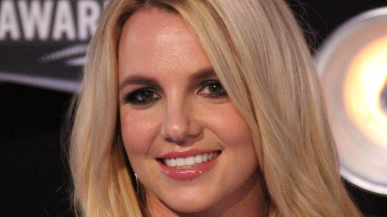 Britney Spears smiles for the camera at an event.