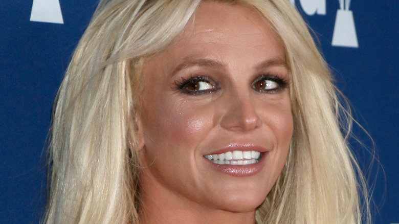 Britney Spears smiles on the red carpet in sparkly dress