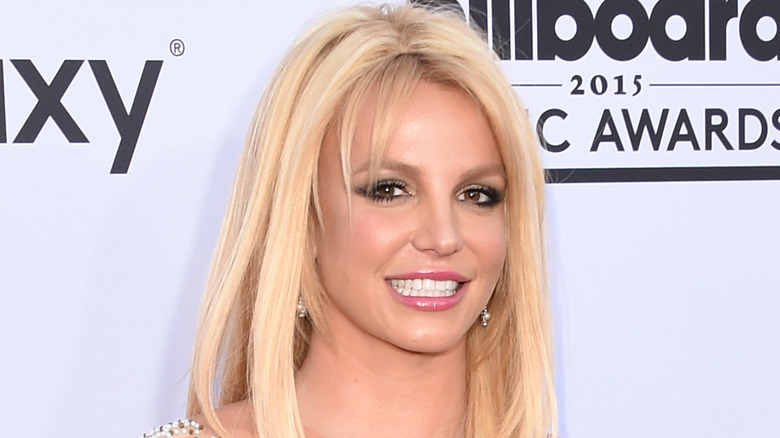 photo of Britney Spears smiling on the red carpet of a music event