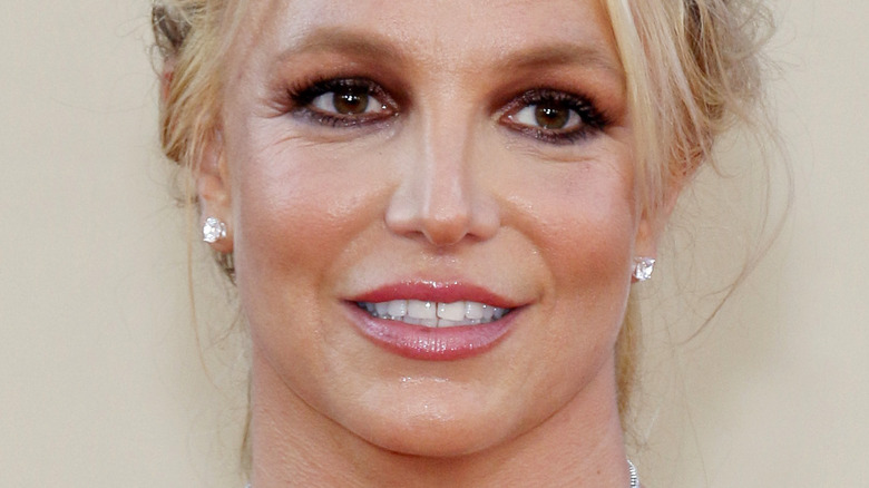 Britney Spears smiling and looking to the side