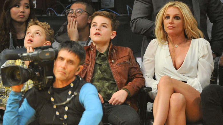 Britney Spears and her sons sitting courtside