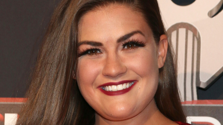 Brittany Cartwright smiles on the red carpet