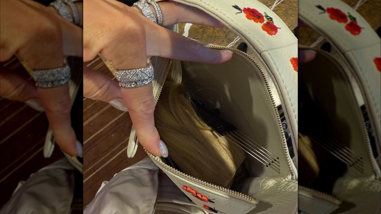 Photo of Brittany Mahomes' open purse, with hair extensions inside