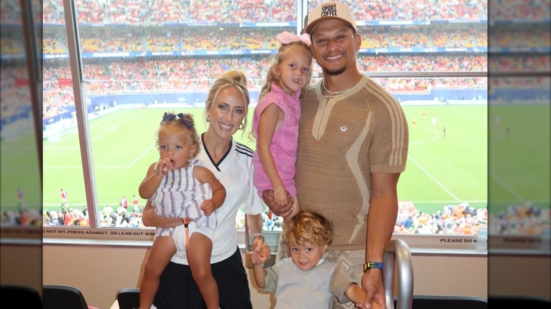 Brittany Mahomes, Patrick Mahomes, and their three kids smile together