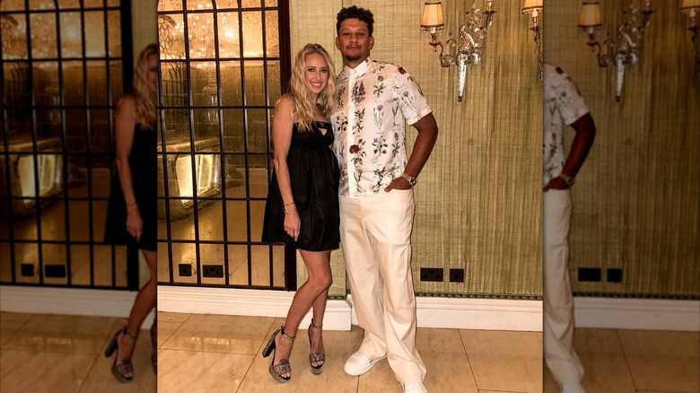 Brittany Mahomes and Patrick Mahomes posing