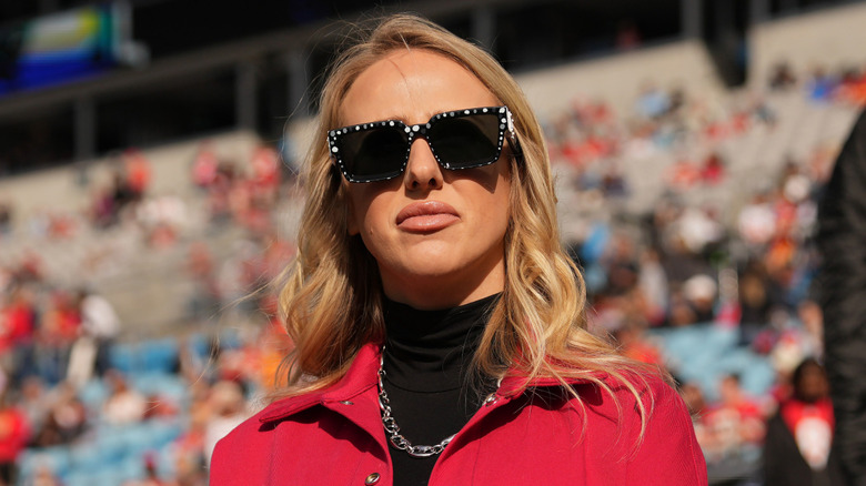 Brittany Mahomes wearing sunglasses in front of crowd