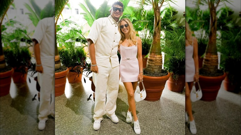 Patrick Mahomes and Brittany Mahomes smile as they pose together at the F1 Miami Grand Prix (2024)