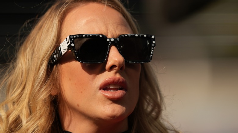 Brittany Mahomes wearing sunglasses while making a face