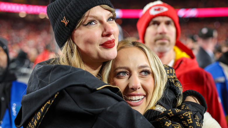 Taylor Swift hugging Brittany Mahomes at a football game