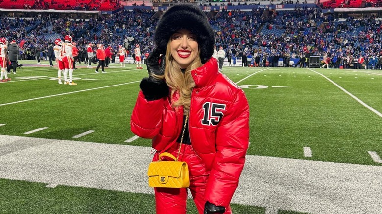 Brittany Mahomes posing on the field