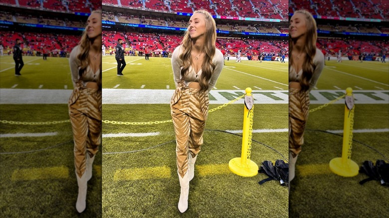 Brittany Mahomes poses on the football field