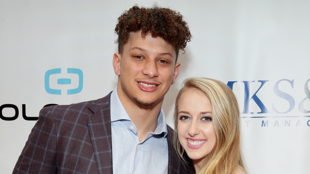 Brittany Matthews, Patrick Mahomes smiling at an event