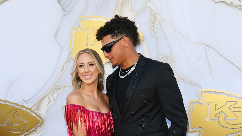 Brittany and Patrick Mahomes on the red carpet at the Kansas City Chiefs Super Bowl Ring Ceremony in June 2024, in Kansas City, Missouri.