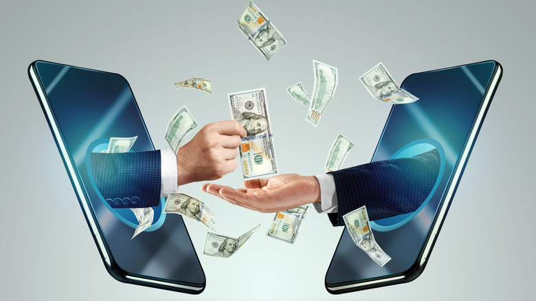 Men transferring money through cell phones