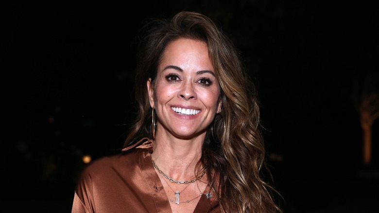 Brooke Burke smiling for press