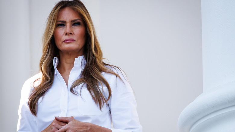 Melania Trump wearing a white top