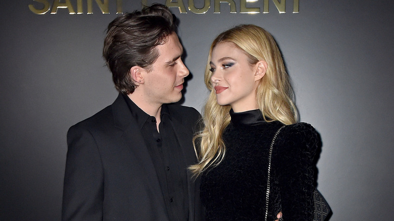 Brooklyn Beckham and Nicola Peltz looking at each other in February 2020