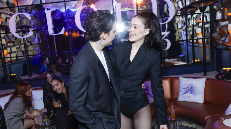 Brooklyn Beckham and Nicola Peltz with their arms around each other in October 2024