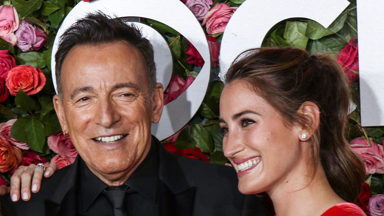 Jessica Springsteen poses with her father on the red carpet