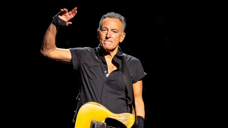 Bruce Springsteen waving onstage