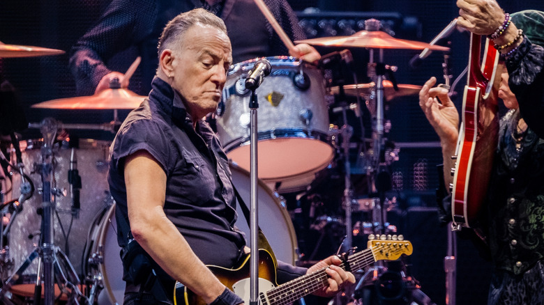 Bruce Springsteen playing the guitar