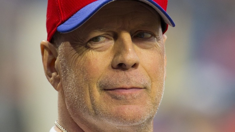 Bruce Willis throwing the first pitch at baseball game