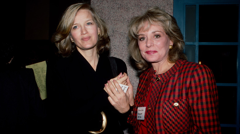 Barbara Walters and Diane Sawyers posing for photos