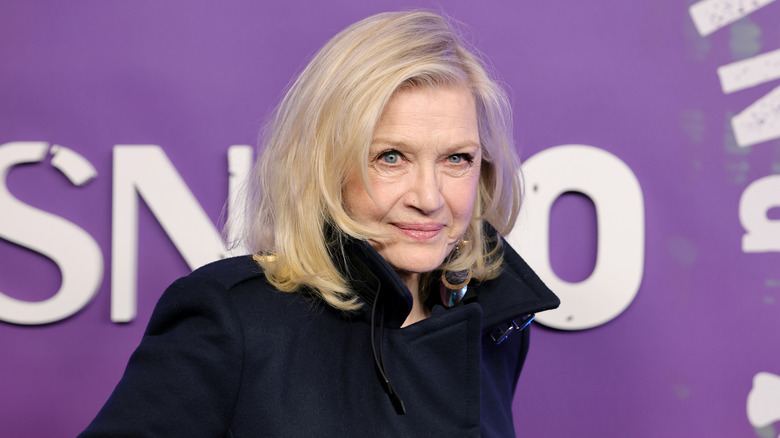 Diane Sawyer posing for photos in a black outfit
