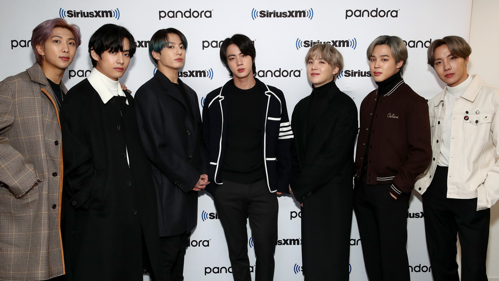 BTS posing at a Pandora SiriusXM event 