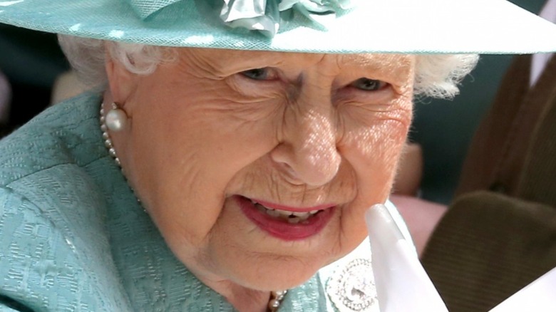 Queen Elizabeth II in blue hat